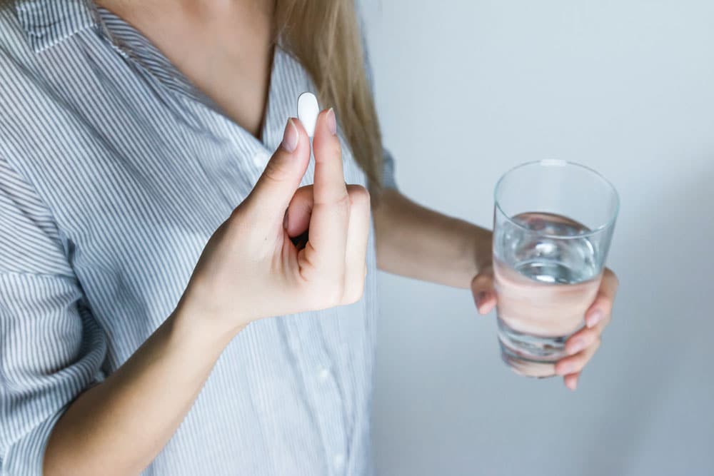 Taking tablet with water