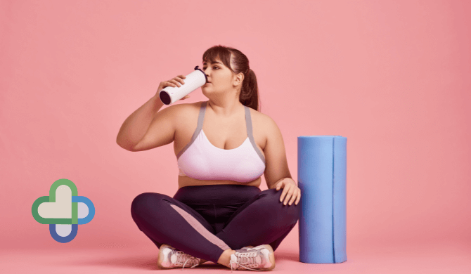 overweight woman on Mounjaro with yoga mat drinking water