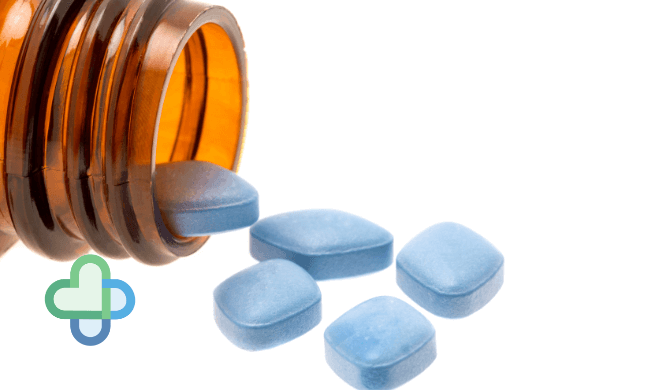 blue Viagra pills coming out of brown bottle - buy sildenafil online