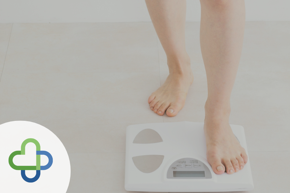 feature pic of person standing on set of scales