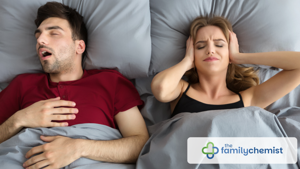 picture of snoring. couple in bed