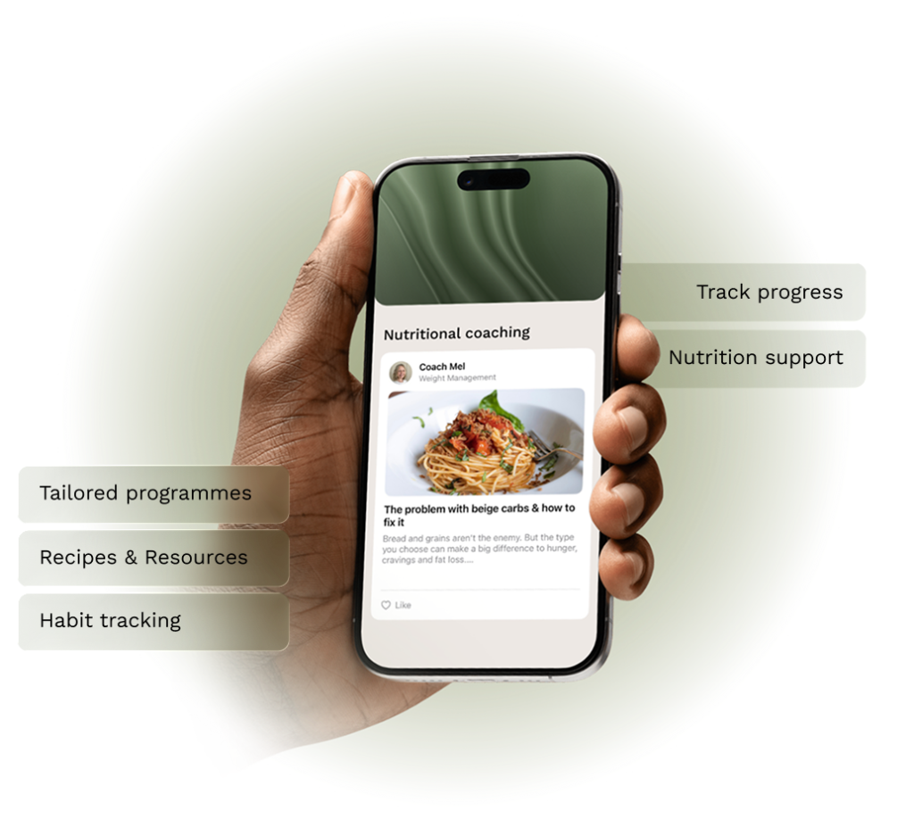 Mobile phone in hand with a nutrition app on the screen showing healthy recipes, tracking habits and progress